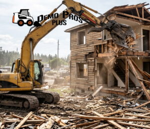 Large yellow excavator tearing down a two-story wooden house with debris scattered around the site